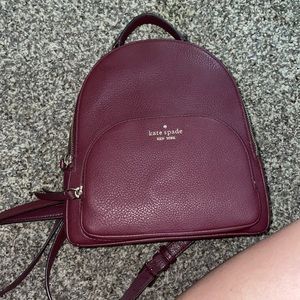 Selling a maroon Kate spade purse/backpack (: